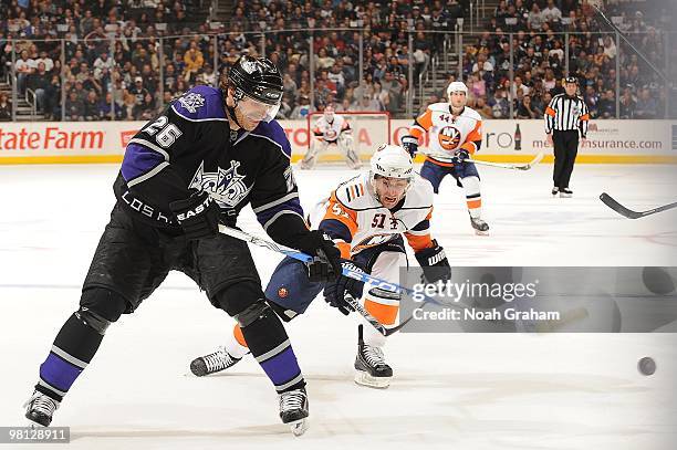 Michal Handzus of the Los Angeles Kings skates ahead of Frans Nielson of the New York Islanders at Staples Center on March 20, 2010 in Los Angeles,...