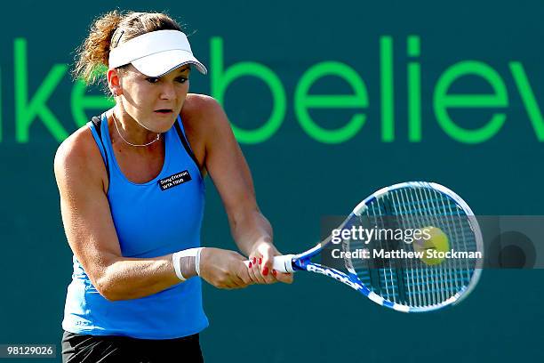 Agnieszka Radwanska of Poland returns a shot against Yaroslava Shvedova of Russia during day seven of the 2010 Sony Ericsson Open at Crandon Park...