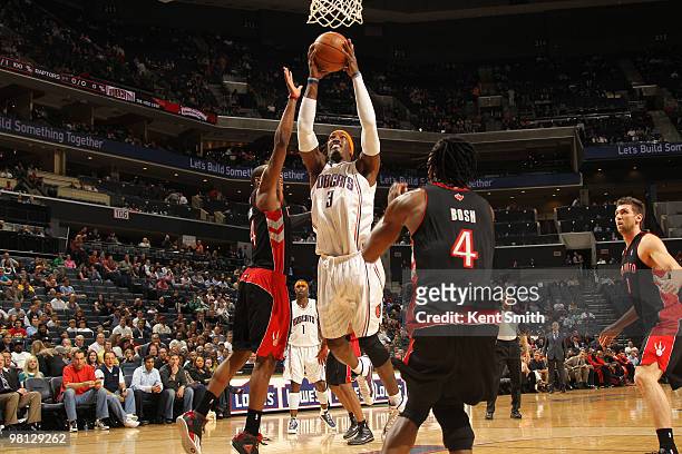 Gerald Wallace of the Charlotte Bobcats goes for the layup against Antoine Wright of the Toronto Raptors on March 29, 2010 at the Time Warner Cable...