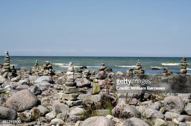 cairn rock stacks on seashore, oland, kalmar county, sweden - kalmar stock pictures, royalty-free photos & images