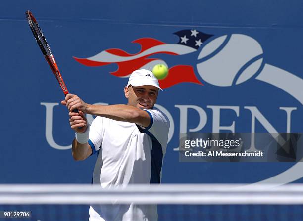 Andre Agassi defeats Xavier Malisse 6-3 6-4 6-7 4-6 6-2 in a men's fourth round match at the 2005 U. S. Open in Flushing, New York on September 5,...
