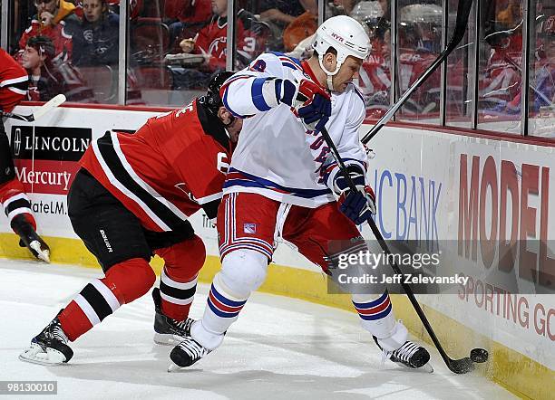 Sean Avery of the New York Rangers skates against Andy Greene of the New Jersey Devils at the Prudential Center on March 25, 2010 in Newark, New...