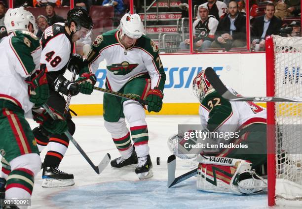 Danny Briere of the Philadelphia Flyers takes a shot on goal against Niklas Backstrom and Kyle Brodziak of the Minnesota Wild on March 25, 2010 at...