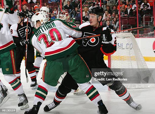 Lukas Krajicek of the Philadelphia Flyers battles on the goal line against Antti Miettinen of the Minnesota Wild on March 25, 2010 at the Wachovia...