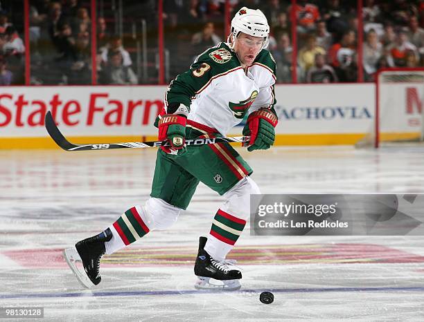 Marek Zidlicky of the Minnesota Wild skates with the puck against the Philadelphia Flyers on March 25, 2010 at the Wachovia Center in Philadelphia,...