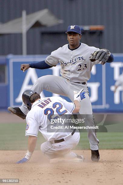 Milwaukee Brewers second baseman Rickie Weeks leaps over sliding New York Mets right fielder Xavier Nady April 15, 2006 at Shea Stadium. The Brewers...