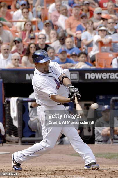 New York Mets first baseman Carlos Delgado bats against the Milwaukee Brewers April 15, 2006 at Shea Stadium. The Brewers defeated the Mets 8 - 2.