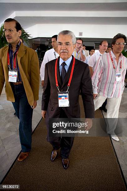 Ali al-Naimi, Saudi Arabia's minister of petroleum and mineral resources, leaves a meeting during the International Energy Forum in Cancun, Mexico,...