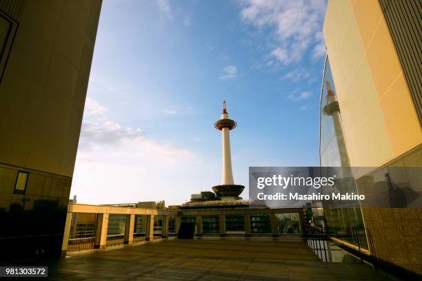 view of kyoto tower from kyoto station, kyoto city - kyoto station stock pictures, royalty-free photos & images