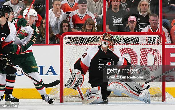 Lukas Krajicek and Brian Boucher of the Philadelphia Flyers defend against Antti Miettinen of the Minnesota Wild on March 25, 2010 at the Wachovia...