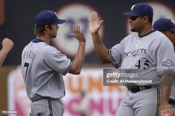Milwaukee Brewers shortstop J. J. Hardy and left fielder Carlos Lee high five to celebrate victory against the New York Mets April 15, 2006 at Shea...