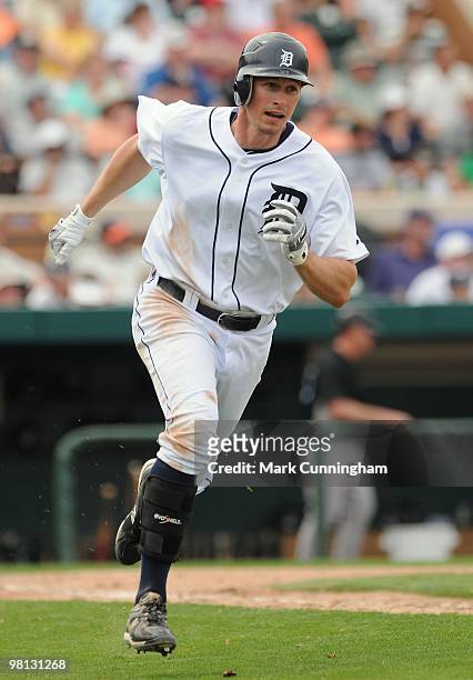 Don Kelly of the Detroit Tigers runs to first base against the Toronto Blue Jays during a spring training game at Joker Marchant Stadium on March 25,...