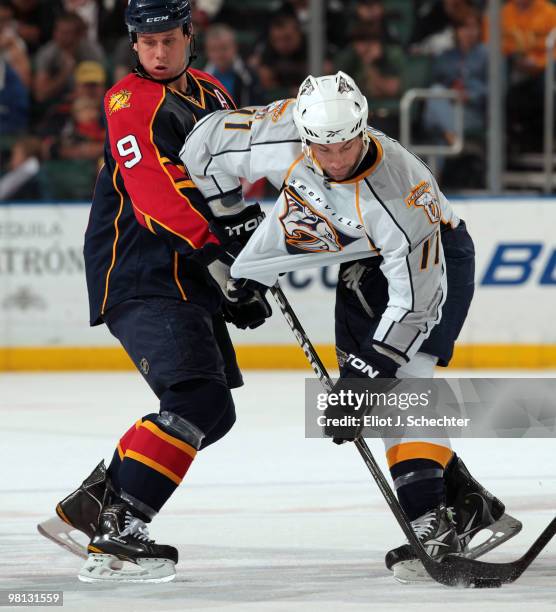 Stephen Weiss of the Florida Panthers crosses sticks with David Legwand of the Nashville Predators after face off at the BankAtlantic Center on March...