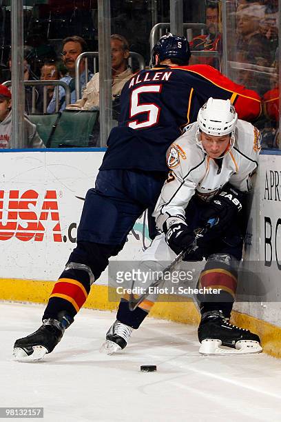 Bryan Allen of the Florida Panthers collides with Jerred Smithson of the Nashville Predators at the BankAtlantic Center on March 29, 2010 in Sunrise,...