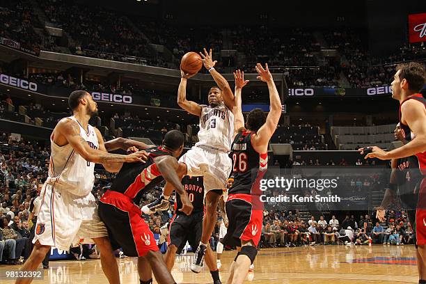 Stephen Graham of the Charlotte Bobcats goes for the shot against Hedo Turkoglu of the Toronto Raptors on March 29, 2010 at the Time Warner Cable...