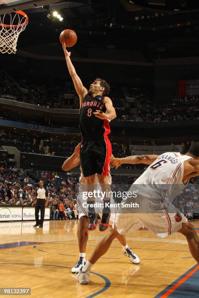 Jose Calderon of the Toronto Raptors goes for the layup against Tyson Chandler of the Charlotte Bobcats on March 29, 2010 at the Time Warner Cable...