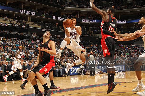 Augustin of the Charlotte Bobcats goes for the layup against Amir Johnson of the Toronto Raptors on March 29, 2010 at the Time Warner Cable Arena in...