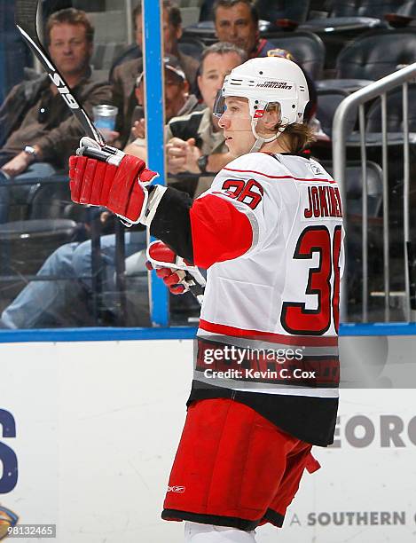 Jussi Jokinen of the Carolina Hurricanes celebrates his empty net goal against the Atlanta Thrashers at Philips Arena on March 29, 2010 in Atlanta,...