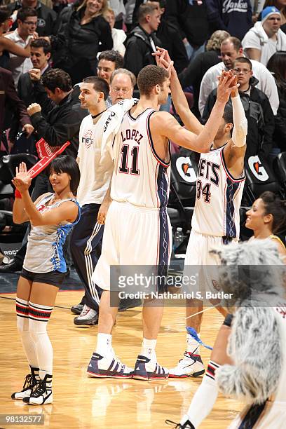Devin Harris and Brook Lopez of the New Jersey Nets react after winning against the San Antonio Spurs on March 29, 2010 at the IZOD Center in East...