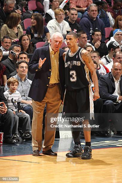 Head coach Gregg Popovich speaks to George Hill of the San Antonio Spurs during game against the New Jersey Nets on March 29, 2010 at the IZOD Center...