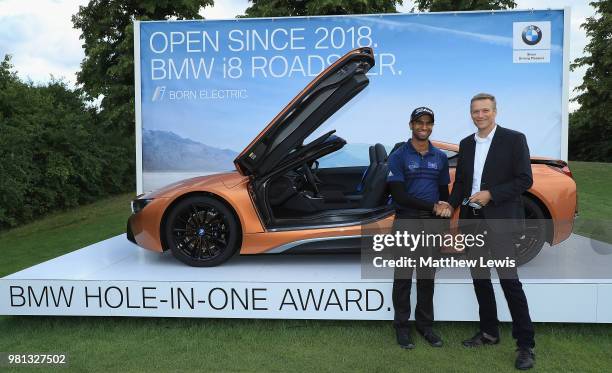 Aaron Rai of England is presented with the keys to a BMW i8 Roadster from Peter van Binsbergen, Head of the German Sales Subsidiary for the BMW...