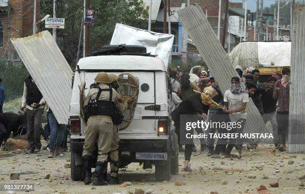 Indian Kashmiri youths clash with Indian government forces on the outskirts of Srinagar on June 22 following a gun fight in southern Kashmir between...