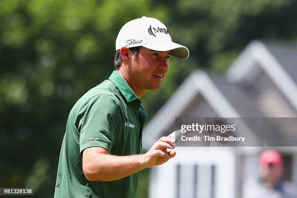 Brian Harman of the United States acknowledges the gallery after making a putt for birdie on the seventh green during the second round of the...