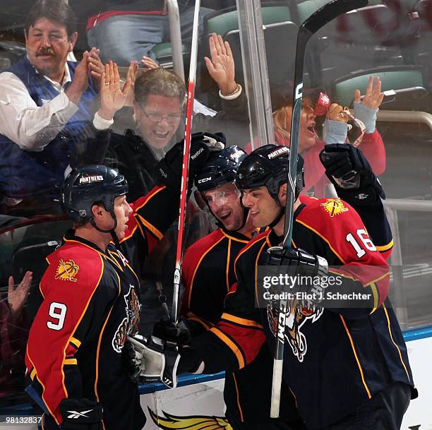 Keith Ballard of the Florida Panthers celebrates a goal with teammates Nathan Horton and Stephen Weiss against the Nashville Predators at the...