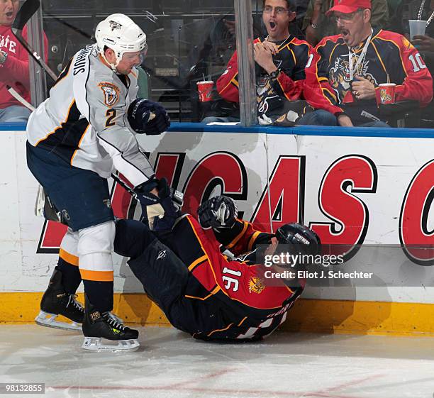 Nathan Horton of the Florida Panthers collides with Dan Hamhuis of the Nashville Predators at the BankAtlantic Center on March 29, 2010 in Sunrise,...