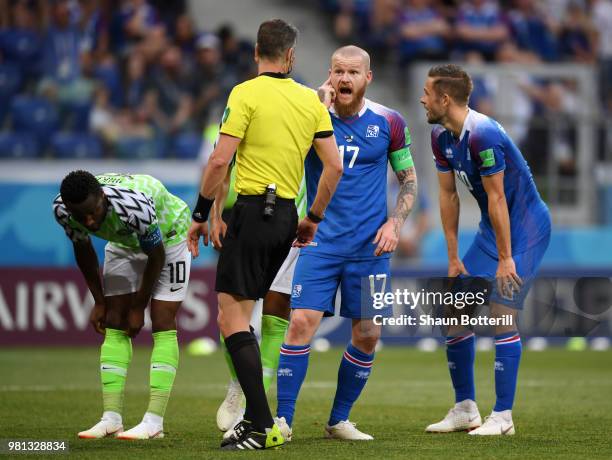 Aron Gunnarsson of Iceland ask to Referee Matthew Conger for a VAR review during the 2018 FIFA World Cup Russia group D match between Nigeria and...