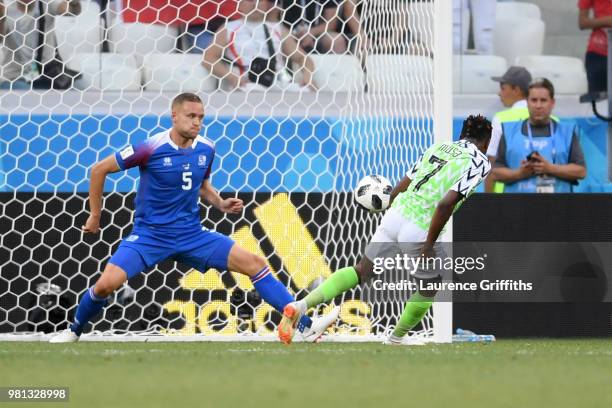 Ahmed Musa of Nigeria scores his team's second goal past Sverrir Ingason of Iceland during the 2018 FIFA World Cup Russia group D match between...