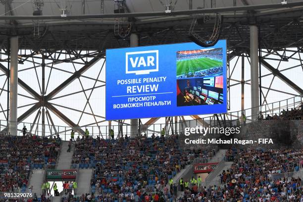 The big screen inside the stadium shows that a VAR review is in place which resulted in Iceland being awarded a penalty during the 2018 FIFA World...