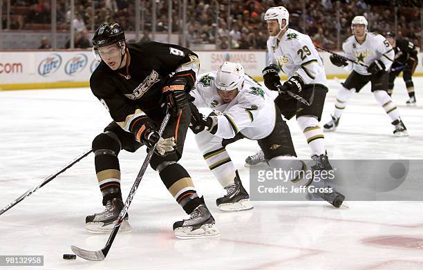 Bobby Ryan of the Anaheim Ducks skates around Nicklas Grossman of the Dallas Star in the first period against at the Honda Center on March 29, 2010...