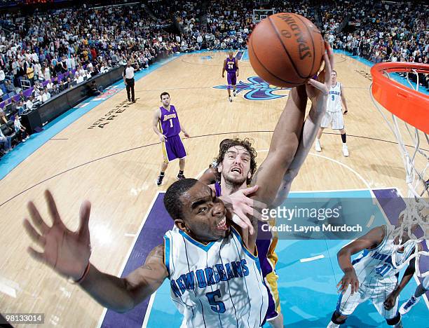 Marcus Thornton of the New Orleans Hornets and Pau Gasol of the Los Angeles Lakers battle for a rebound on March 29, 2010 at the New Orleans Arena in...