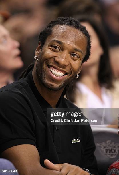 Wide receiver Larry Fitzgerald of the Arizona Cardinals attends the NBA game between the Portland Trail Blazers and the Phoenix Suns at US Airways...