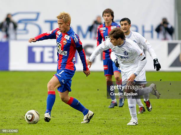 Keisuke Honda of PFC CSKA Moscow battles for the ball with Kirill Kombarov of FC Dynamo Moscow during the Russian Football League Championship match...