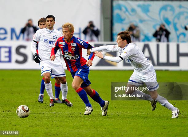 Keisuke Honda of PFC CSKA Moscow battles for the ball with Kirill Kombarov of FC Dynamo Moscow during the Russian Football League Championship match...