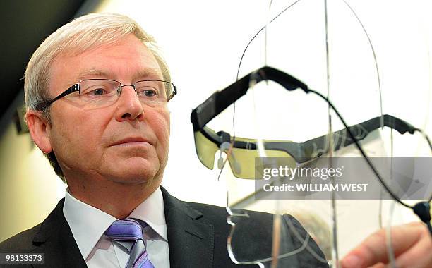 Australian Prime Minister Kevin Rudd inspects a prototype bionic eye which will deliver improved quality of life for patients suffering from...
