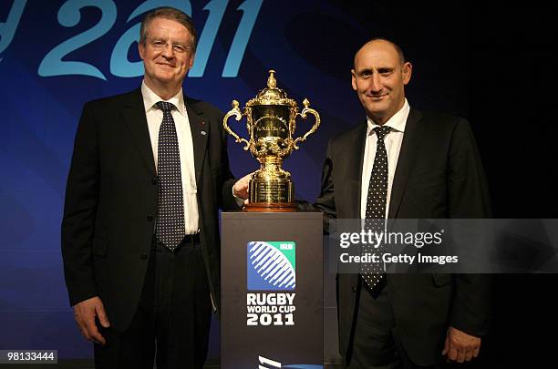 Bernard Lapasset of Rugby World Cup Limited and Jock Hobbs of New Zealand Rugby Union pose with the Webb Ellis Cup during the Official Ticket Sales...