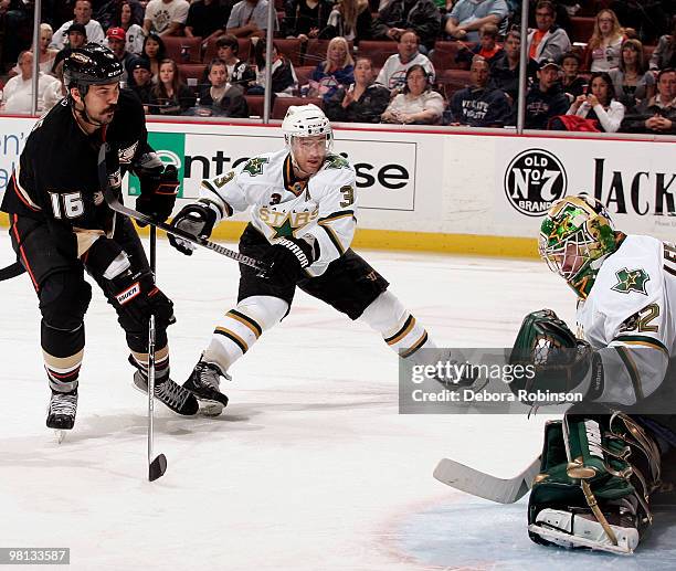 George Parros of the Anaheim Ducks shoots the puck against Kari Lehtonen of the Dallas Stars during the game on March 29, 2010 at Honda Center in...