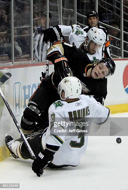 Stephane Robidas of the Dallas Stars, Bobby Ryan of the Anaheim Ducks and Karlis Skrastins of the Stars get tangled up while pursuing the puck in the...