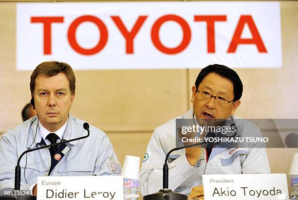 Akio Toyoda , president of Japanese automaker Toyota Motor, speaks flanked by European chief quality officer Didier Leroy at a press conference after...