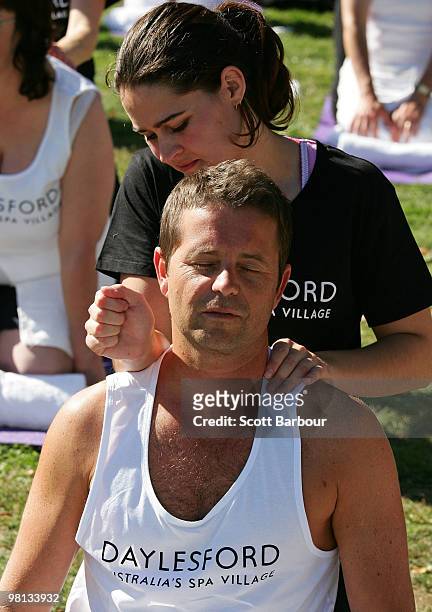 Television presenter Steven Jacobs receives a professional massage from a qualified therapist as he takes part in a world record for the largest ever...