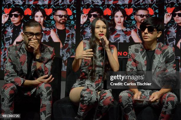 Denisse Guerrero of Belanova speaks next to her partners Ricardo Arreola and Edgar Huerta during a press conference to promote their new album 'Viaje...