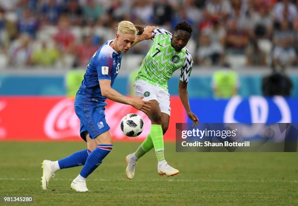 Hordur Magnusson of Iceland battles for possession with Ahmed Musa of Nigeria during the 2018 FIFA World Cup Russia group D match between Nigeria and...