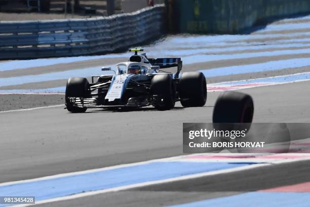 William's Russian driver Sergey Sirotkin drives during the second practice session as the tire of Force India's Mexican driver Sergio Perez's car...