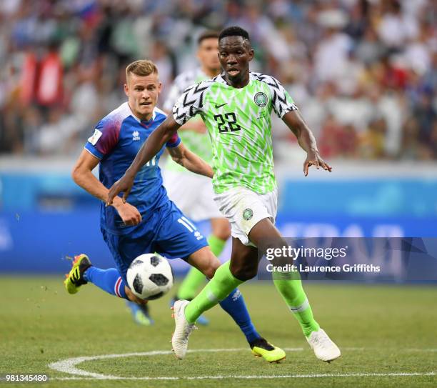 Kenneth Omeruo of Nigeria is challenged by Alfred Finnbogason of Iceland during the 2018 FIFA World Cup Russia group D match between Nigeria and...