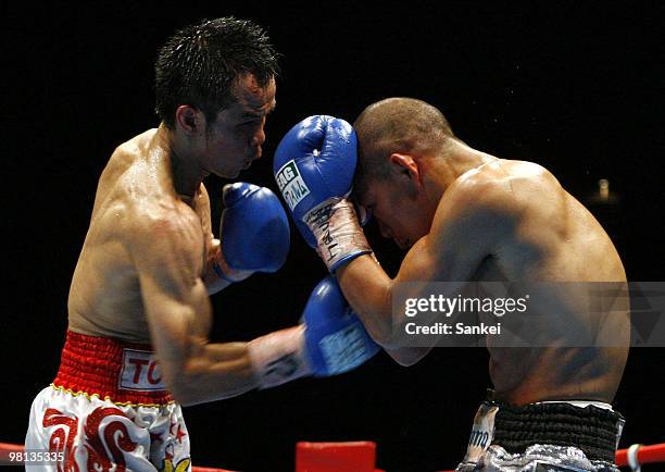 Pongsaklek Wonjogkam of Thailand hits his right on Koki Kameda of Japan during the WBC flyweight title bout at Ariake Colosseum on March 27, 2010 in...