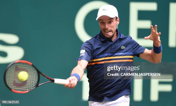 Roberto Bautista Agut from Spain returns the ball to Karen Khachanov from Russia during their match at the ATP Gerry Weber Open tennis tournament in...