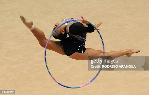 Argentinian Ana Milagros Carrasco competes in the individual hoop competition in rhythmic gimnastics during the IX South American Games in Medellin,...